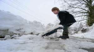 Small children are also engaged in helping the elders in removing the snow.