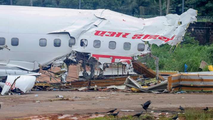  Mangled remains of an Air India Express flight, en route from Dubai, after it skidded off the runwa