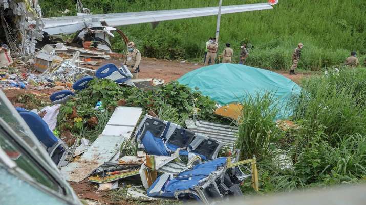 Mangled remains of an Air India Express flight, en route from Dubai, after it skidded off the runway