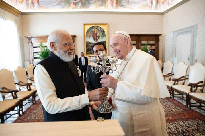 PM Modi presents silver candelabram and book to Pope Francis