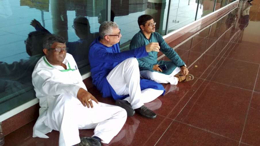 Derek O'Brien led TMC delegation sit on a dharna, after they were stopped by police at the airport.