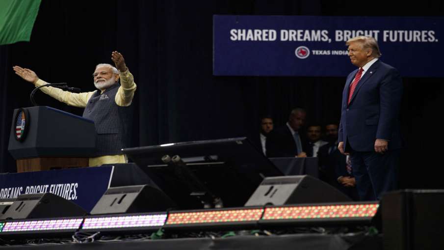President Donald Trump stands on stage with Indian Prime Minister Narendra Modi