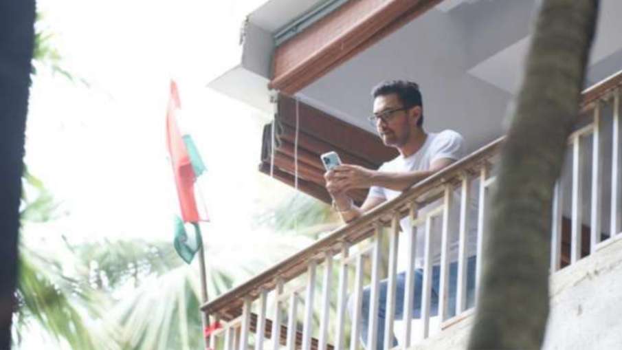 National flag waves behind Aamir Khan at his residence