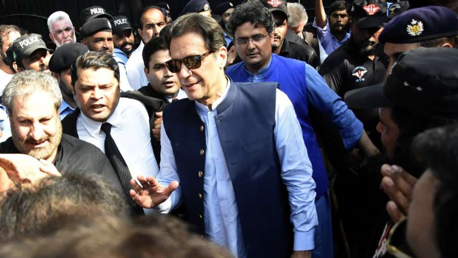 Former Pakistani Prime Minister Imran Khan, center, arrives to the High Court in Islamabad, Pakistan