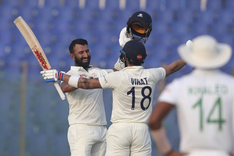 Cheteshwar Pujara celebrating his fastest Test century with Virat Kohli