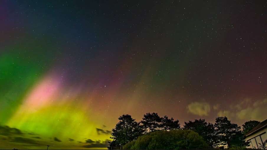 Northen Lights, or aurora borealis, illuminate the sky in Alaiedon Township