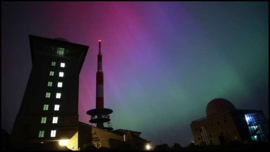 Northern lights appear in the night sky above the Brocken in Schierke, northern Germany