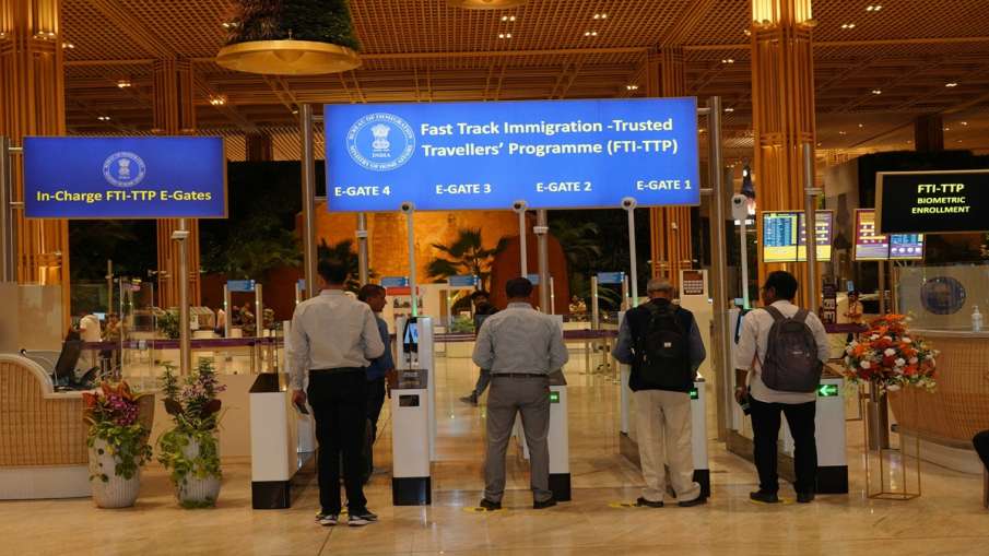 Passengers using the fast track immigration facility at Bengaluru airport.