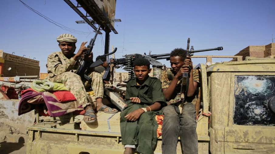 People armed with weapons in Sudan