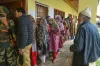 Voters wait in a long queue to cast their votes for the...- India TV Hindi