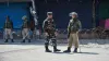 Security personnel stand guard during restrictions in Srinagar.- India TV Hindi