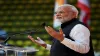 Prime Minister Narendra Modi gestures while addressing the crowd during the 'Sawasdee PM Modi’ event- India TV Paisa