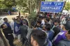 Relatives of Anaj Mandi fire victims wait outside the...- India TV Hindi
