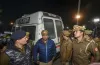 Policemen stand near an ambulance carrying the mortal...- India TV Hindi
