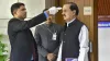 An official uses thermal screening device on BJP leader Mahesh Chandra Sharma at Parliament House in- India TV Hindi
