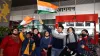 Family members holding the national flag receive Indian...- India TV Hindi