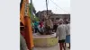 JCB rescues a bull after it falls down in a well during a clash with another bull- India TV Hindi