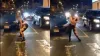 बीच सड़क पर डांस करती हुई महिला।- India TV Hindi