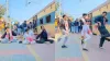 स्टेशन पर डांस करते हुए लड़के- India TV Hindi