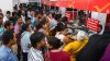 पोस्ट ऑफिस की एक शाखा में काउंटर पर अपनी बारी का इंतजार करते लोग।- India TV Paisa