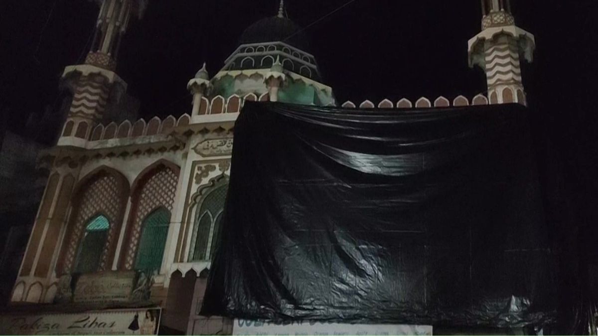 The mosque in Aligarh which is covered with black tarpaulin before Holi