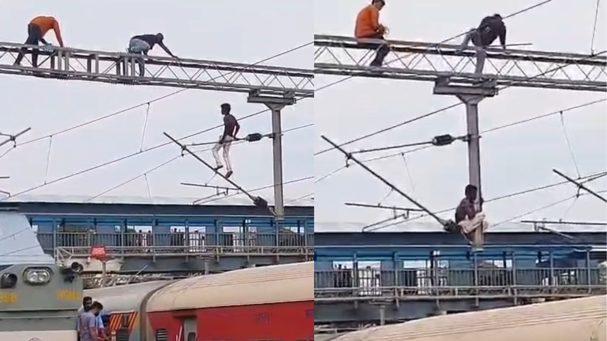 रेलवे स्टेशन पर लगे बिजली के खंभे पर चढ़ गया शख्स, उतारने में छूटे पसीने; VIDEO वायरल - India TV Hindi