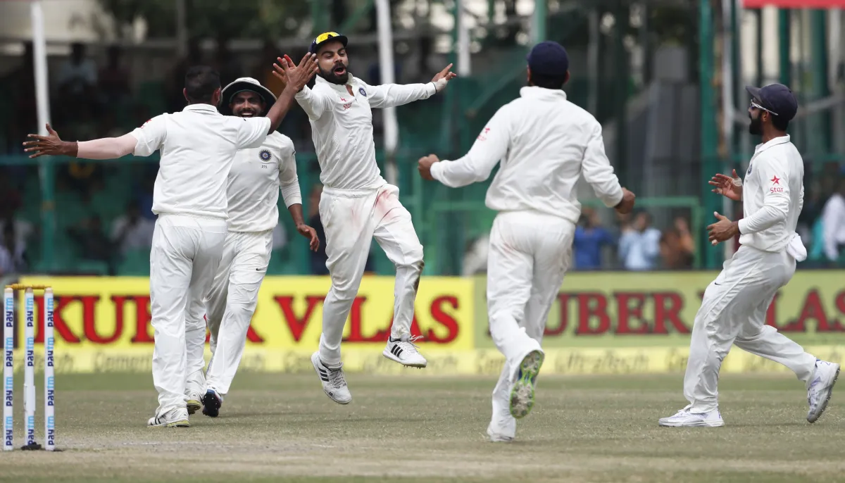  Virat Kohli celebrates with team mates after the fall of...- India TV Hindi