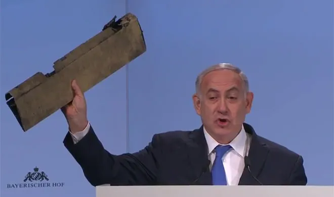 Benjamin Netanyahu while holding wreckage of a ‘Iran drone’- India TV Hindi