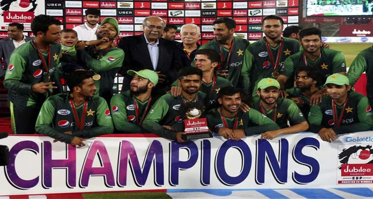 Pakistani cricket players pose with a trophy after beating...- India TV Hindi