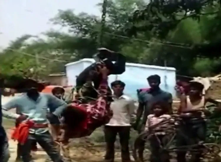 Man beaten and hung upside down for stealing a mobile phone...- India TV Hindi