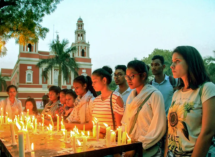 People gather during a candlelight vigil to protest against...- India TV Hindi