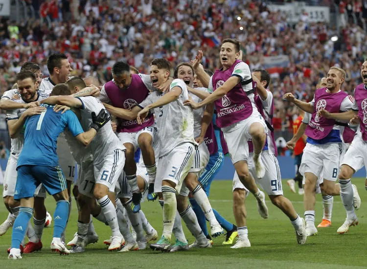 Members of the Russian team celebrate after winning a...- India TV Hindi