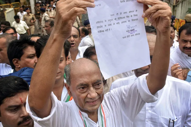 Digvijay Singh shows his clean-chit letter, obtained from a...- India TV Hindi