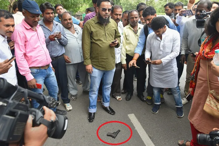 People gather near the pistol used to attempt a shot at...- India TV Hindi