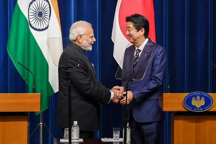 Prime Minister Narendra Modi shakes hands with his Japanese...- India TV Paisa