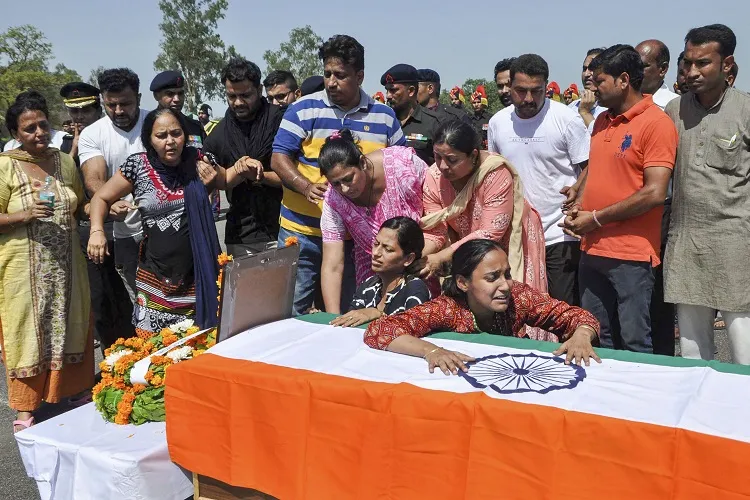 Family member mourns near the coffin of Major Ketan Sharma.- India TV Hindi