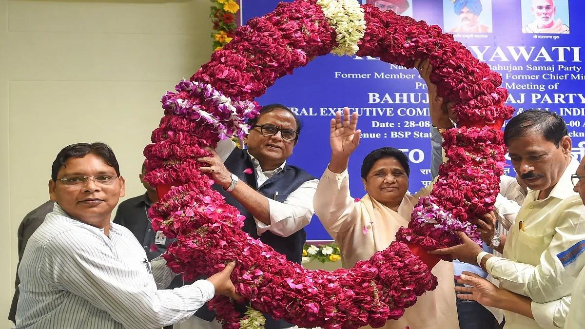 BSP supremo Mayawati waves as she is garlanded by the party...- India TV Hindi