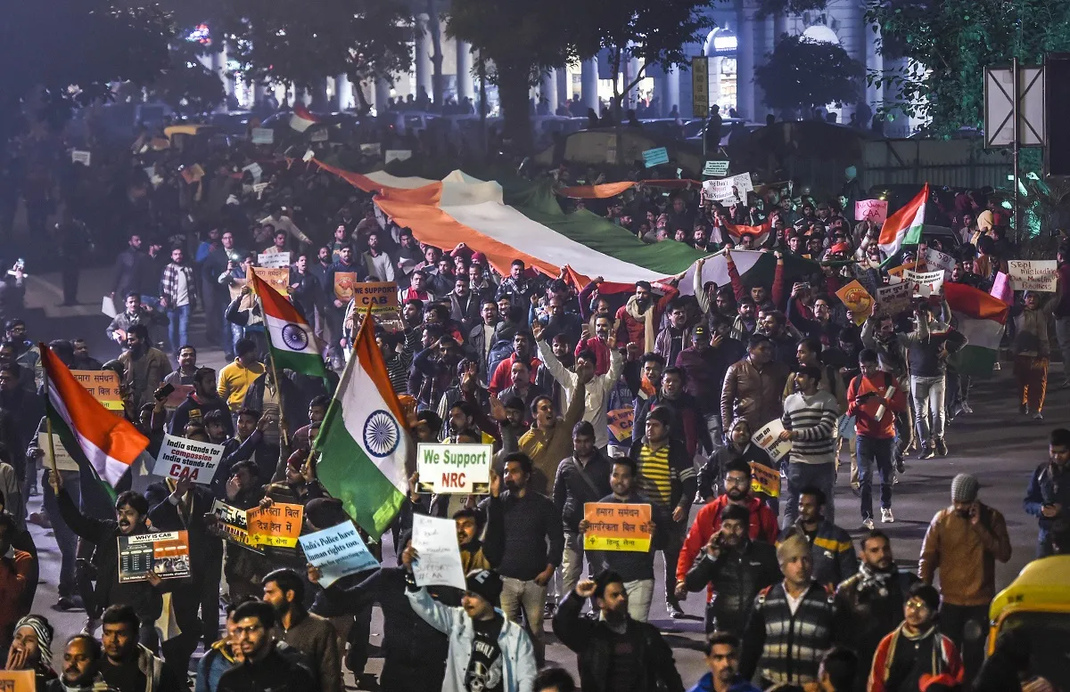  Citizenship Amendment Act (CAA) supporters hold the...- India TV Hindi