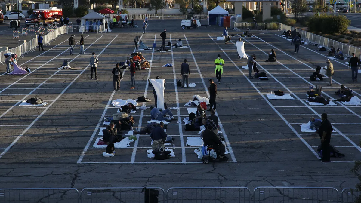 People prepare places to sleep at a makeshift camp for the homeless in Las Vegas.- India TV Hindi
