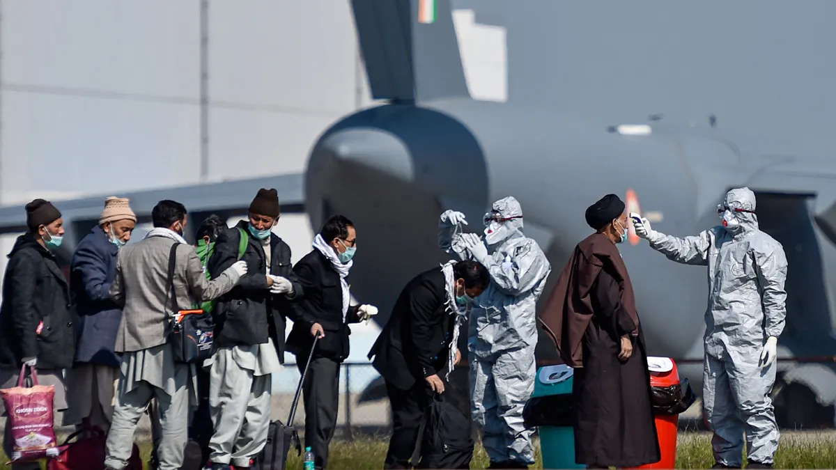 Medics screeen Indian nationals after they were brought to India by Indian Air Force's (IAF) C-17 Gl- India TV Hindi
