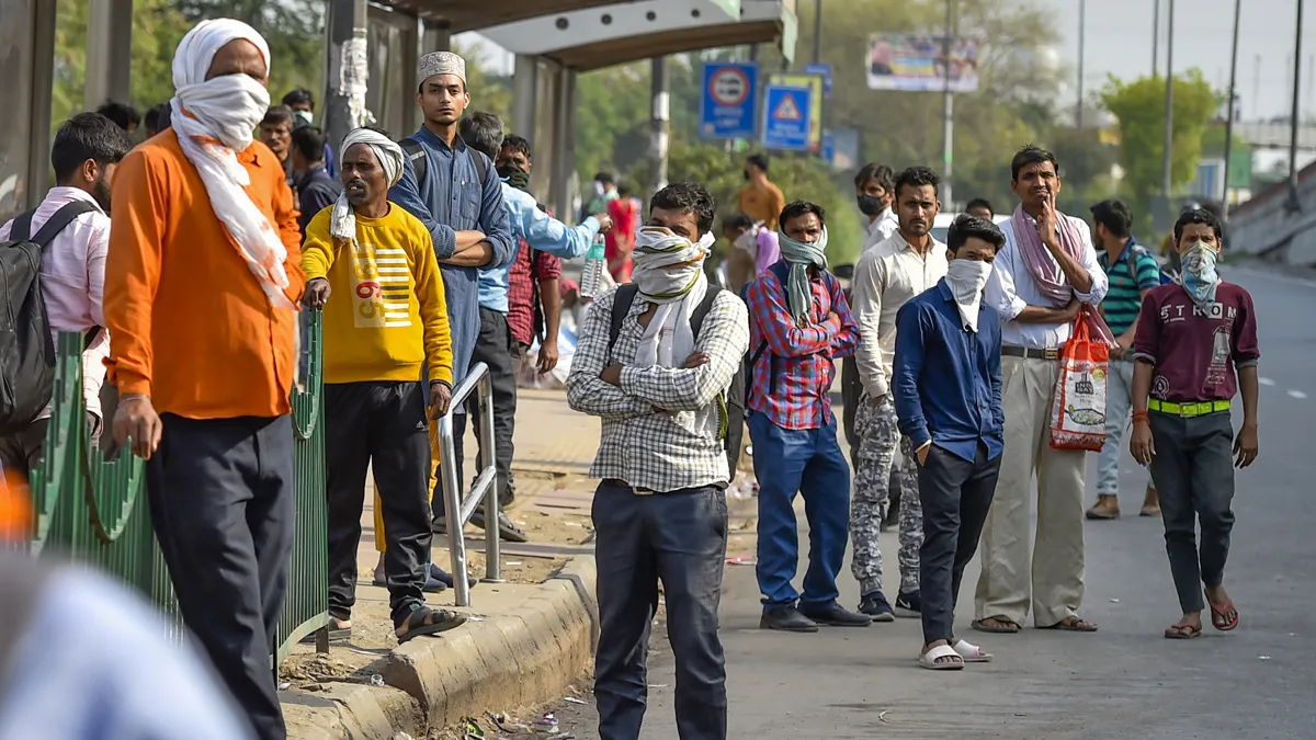 Passengers wait for a DTC bus outside Sarai Kale Khan Bus...- India TV Hindi