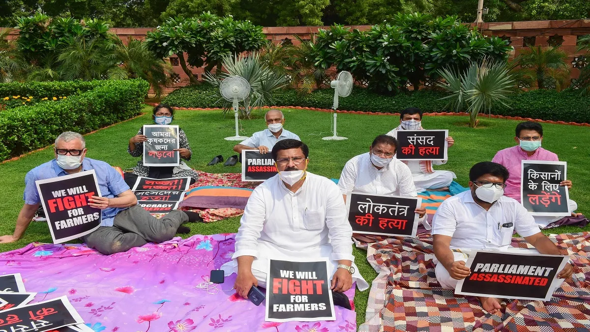 Eight suspended Rajya Sabha MPs display placards as they stage a protest over their suspension, duri- India TV Hindi