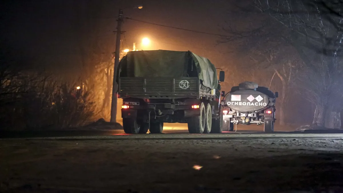 Military trucks move down a street outside Donetsk, eastern Ukraine- India TV Hindi