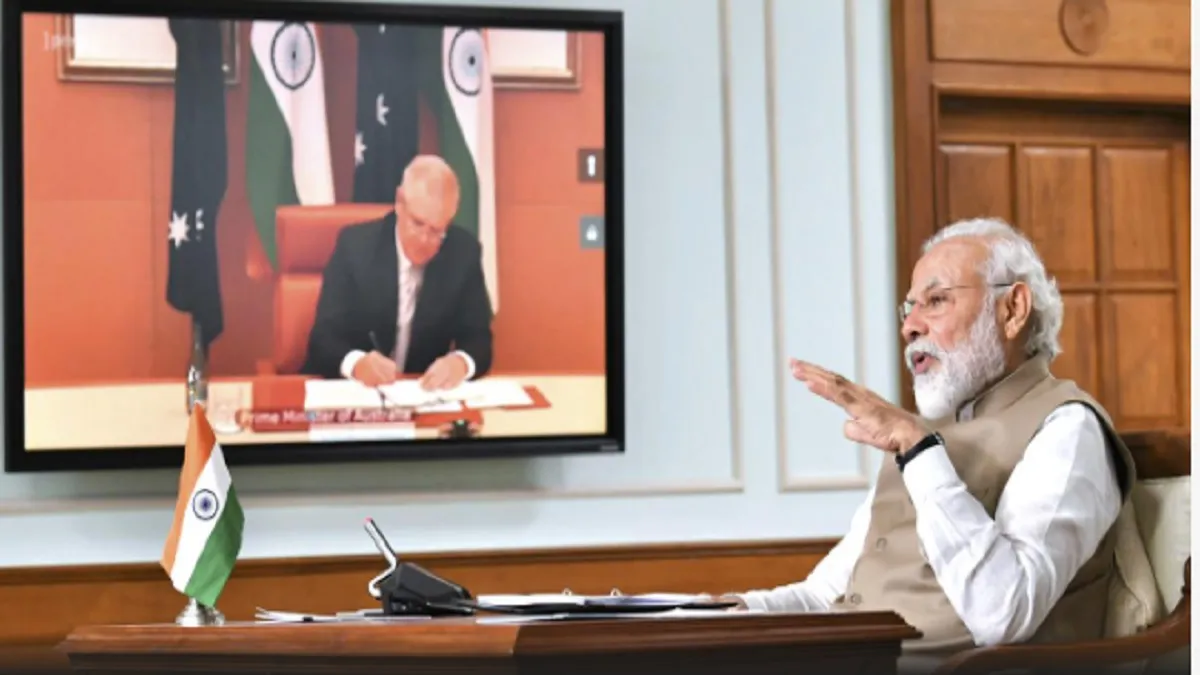 Prime Minister Narendra Modi speaks during a virtual meeting with Australian Prime Minister Scott Mo- India TV Hindi