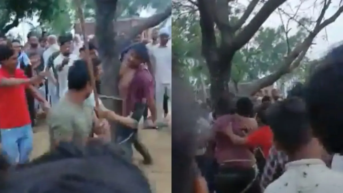 युवक को पेड़ में बांधकर पीटते हुए लोग।- India TV Hindi