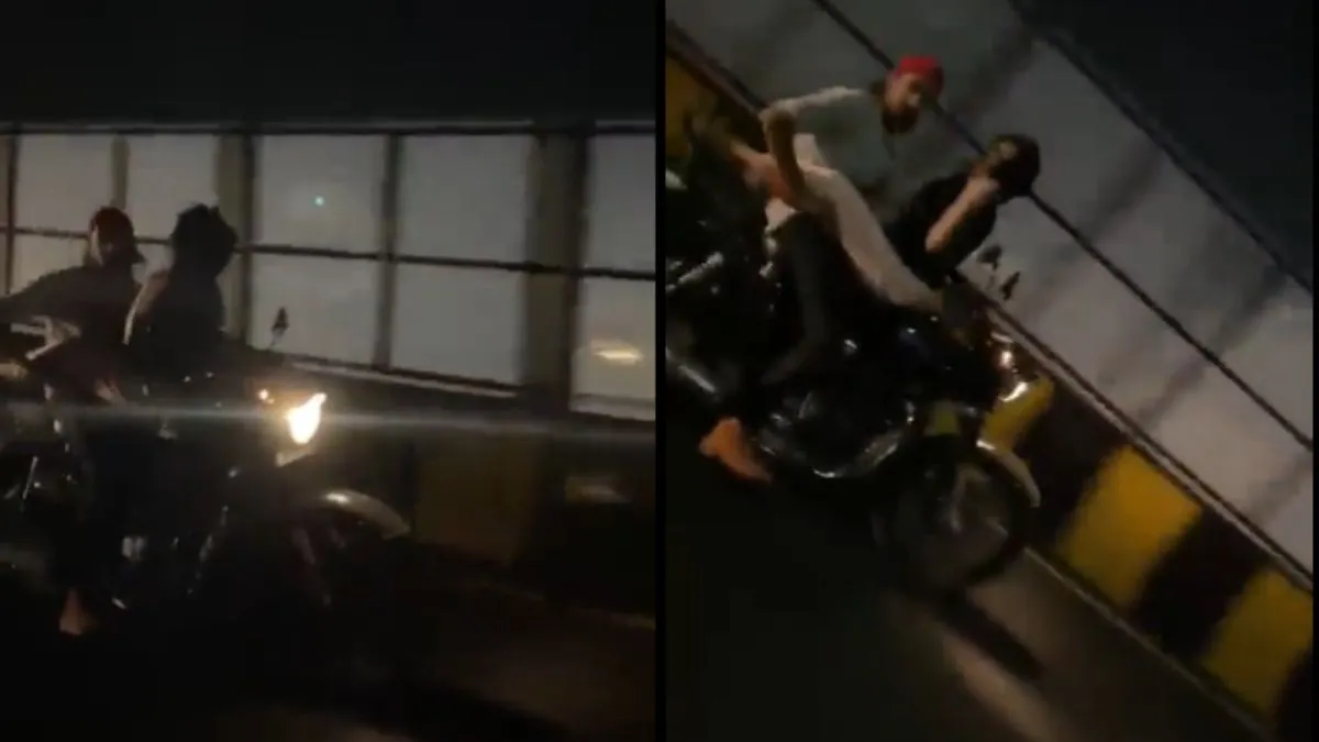 बाइक पर रोमांस करते हुए कपल।- India TV Hindi