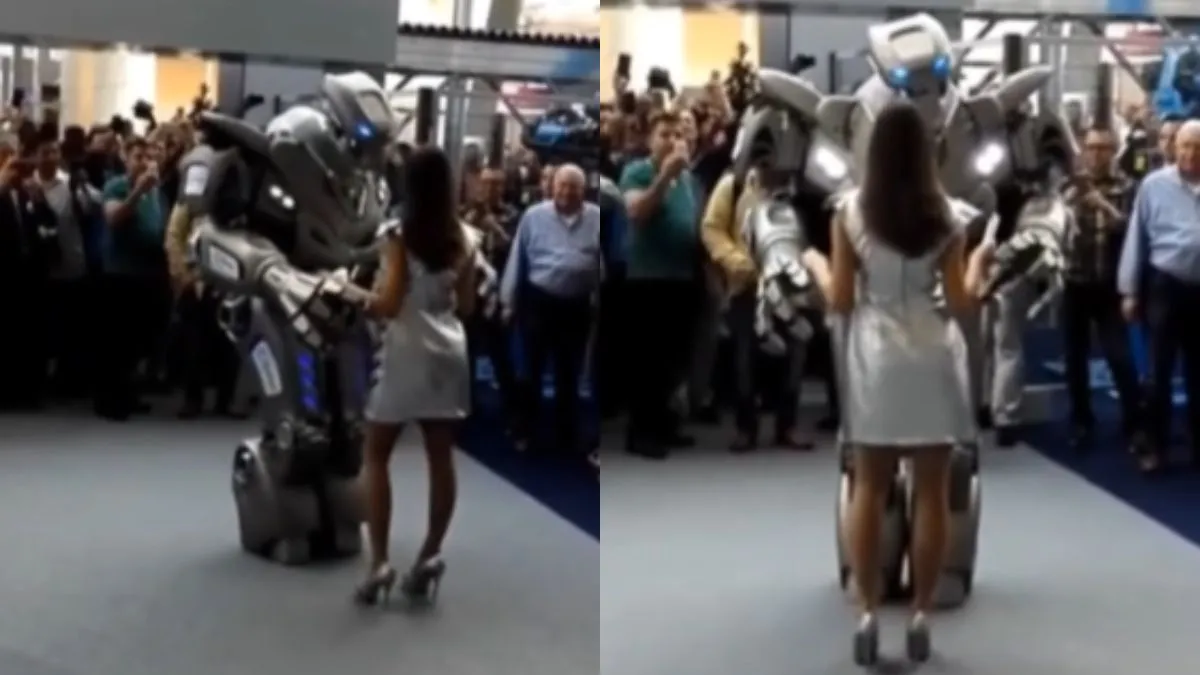 रोबोट के साथ डांस करती हुई लड़की।- India TV Hindi