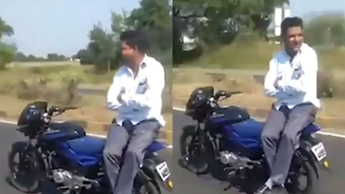 बाइक पर खतरनाक स्टंट करता हुआ शख्स- India TV Hindi