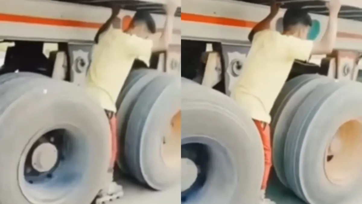 ट्रक के घूमते पहियों के बीच स्केटिंग करता हुआ शख्स- India TV Hindi