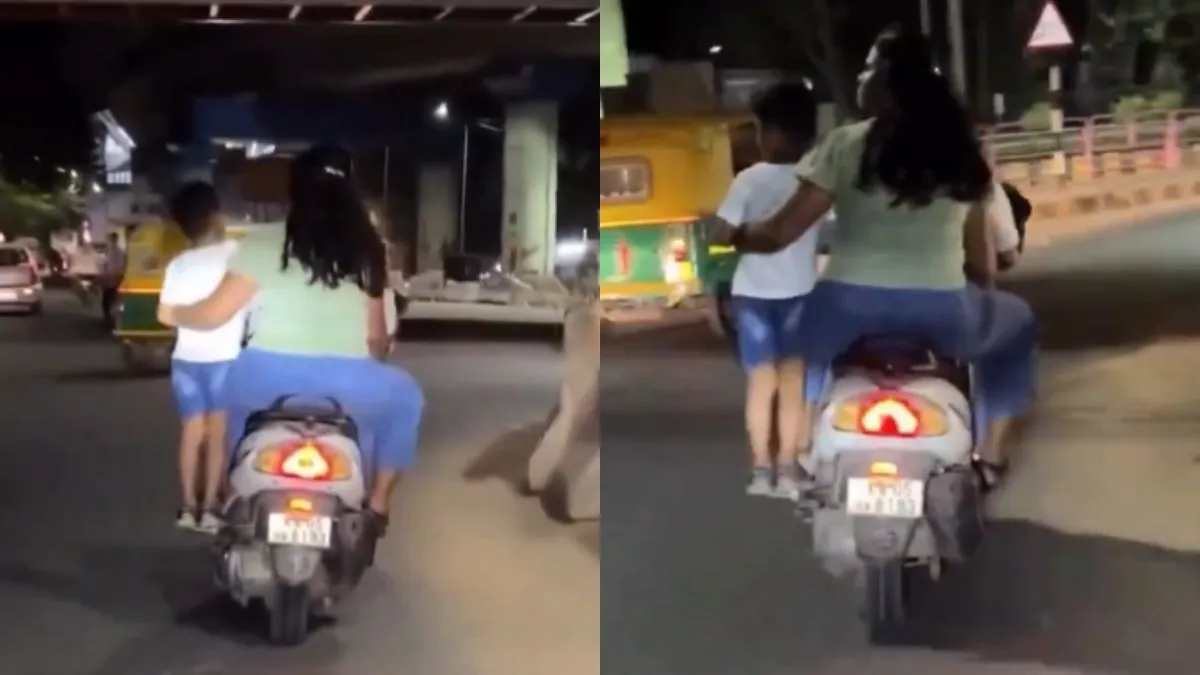 बेटे को स्कूटी के लेडी फुटरेस्ट पर खड़ा करके ले जाते हुए पैरेंट्स- India TV Hindi